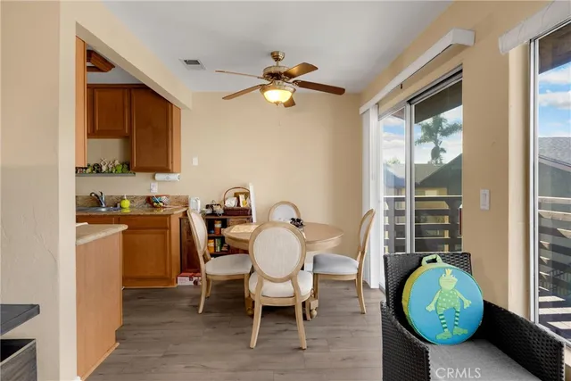 a living room with furniture a chandelier and a window