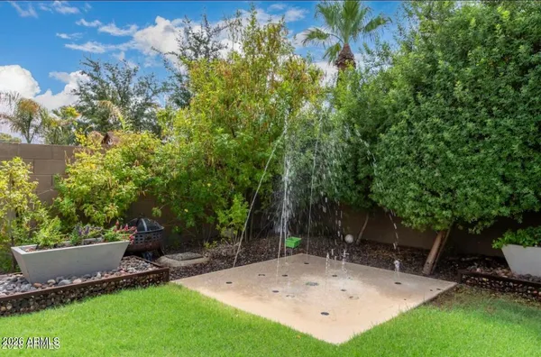 a view of a backyard with sitting area