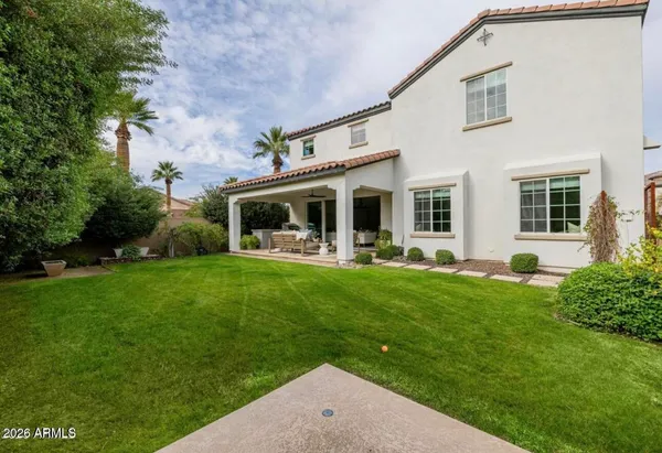 a view of a house with a yard porch and sitting area