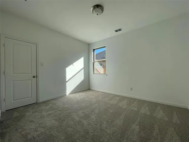 a bathroom with a sink a toilet a mirror and shower
