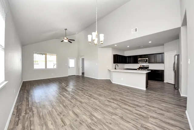 a view of kitchen and kitchen with wooden floor