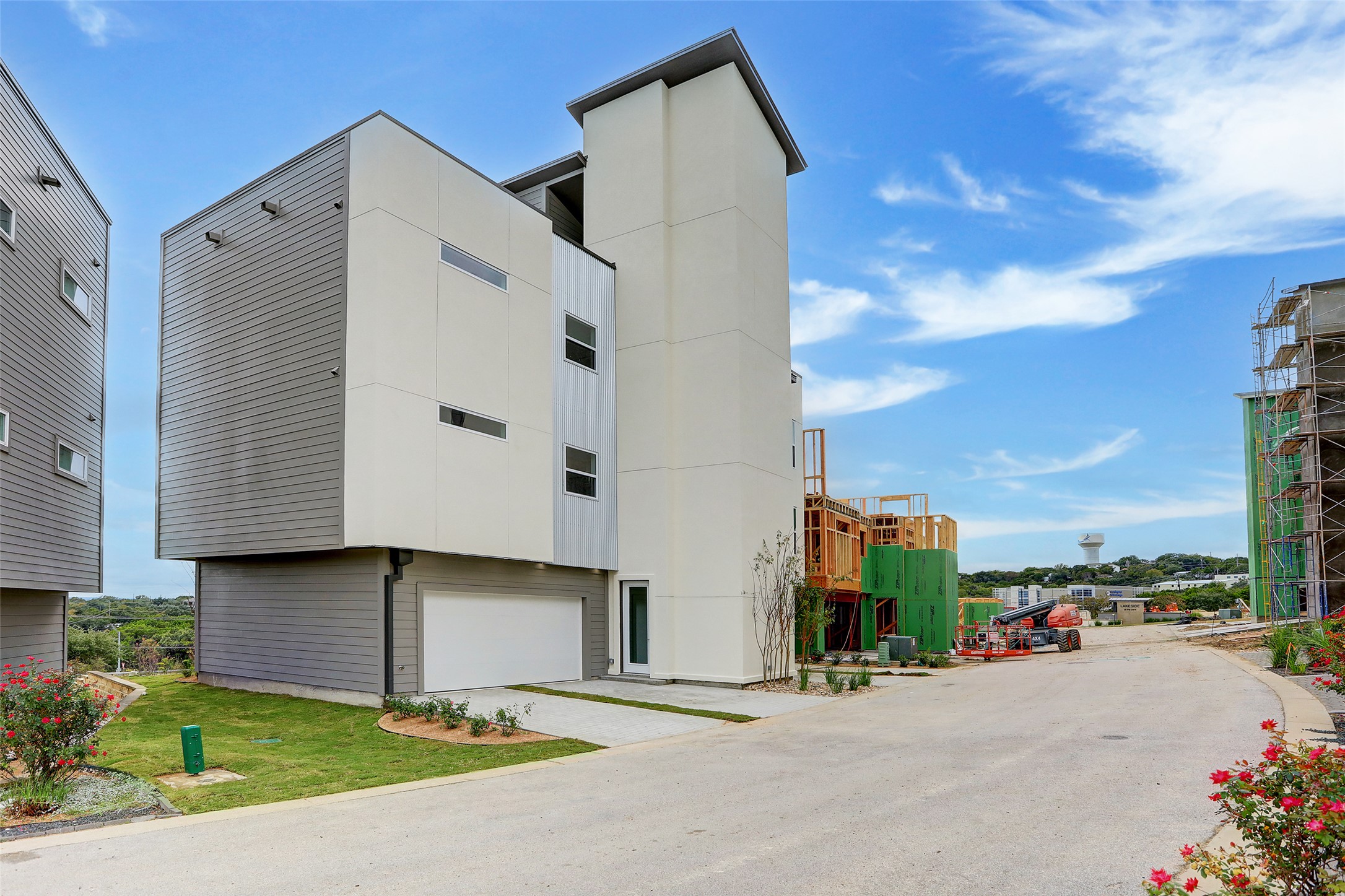 4300 Mansfield Dam Road, Unit 1521 / 1531 Austin, TX 78734 - Photo 2 of 31 a tall building with a large parking space and a car parked in front of it