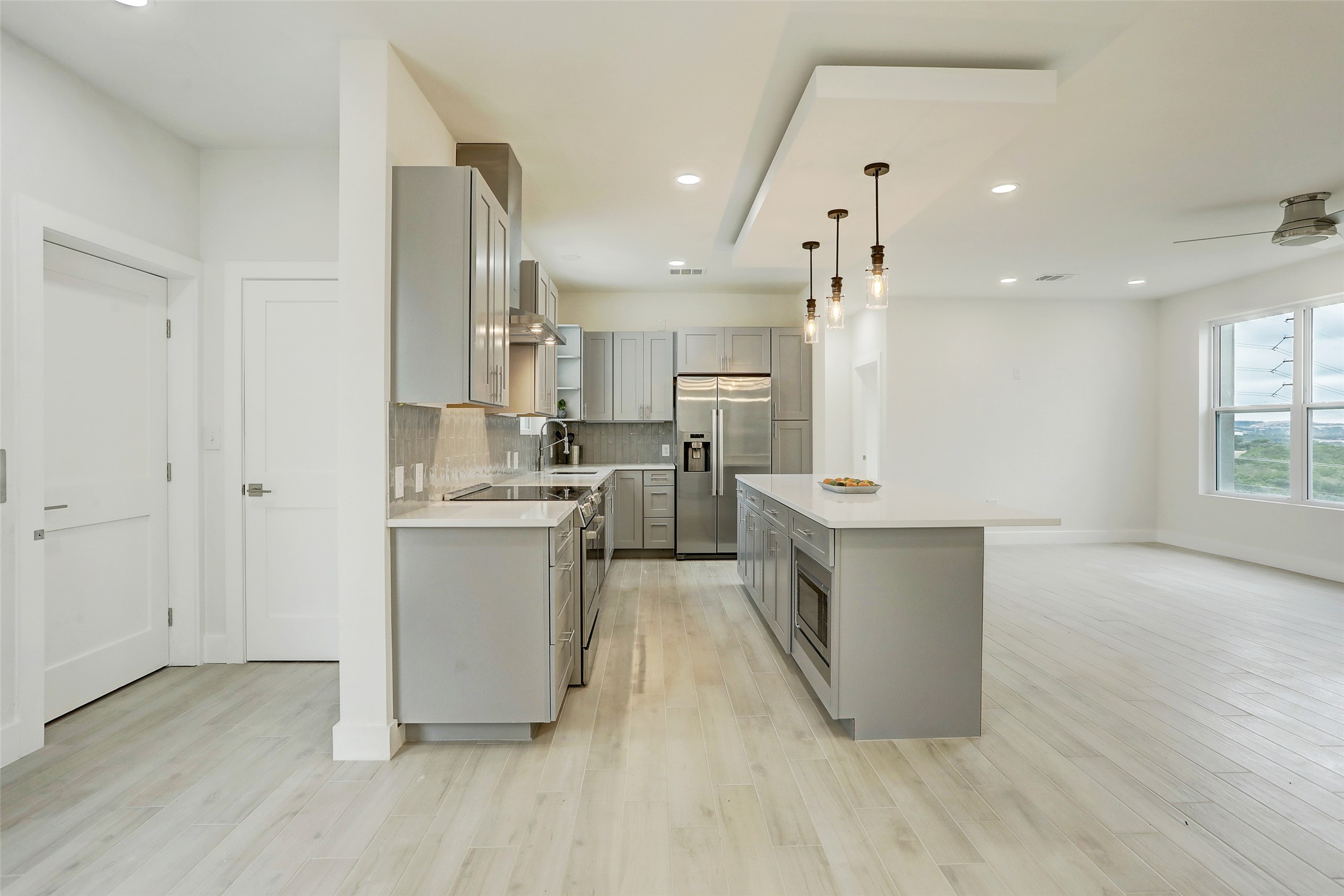 4300 Mansfield Dam Road, Unit 1521 / 1531 Austin, TX 78734 - Photo 5 of 31 a large kitchen with a large counter top a sink stainless steel appliances and cabinets