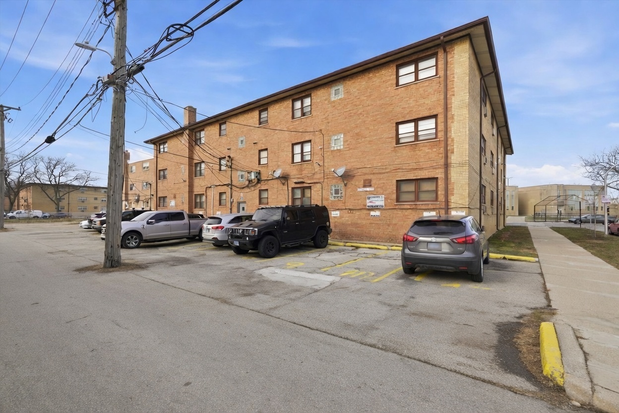 2153 East 87th Street Chicago, IL 60617 - Photo 9 of 9 a view of cars parked in front of a building