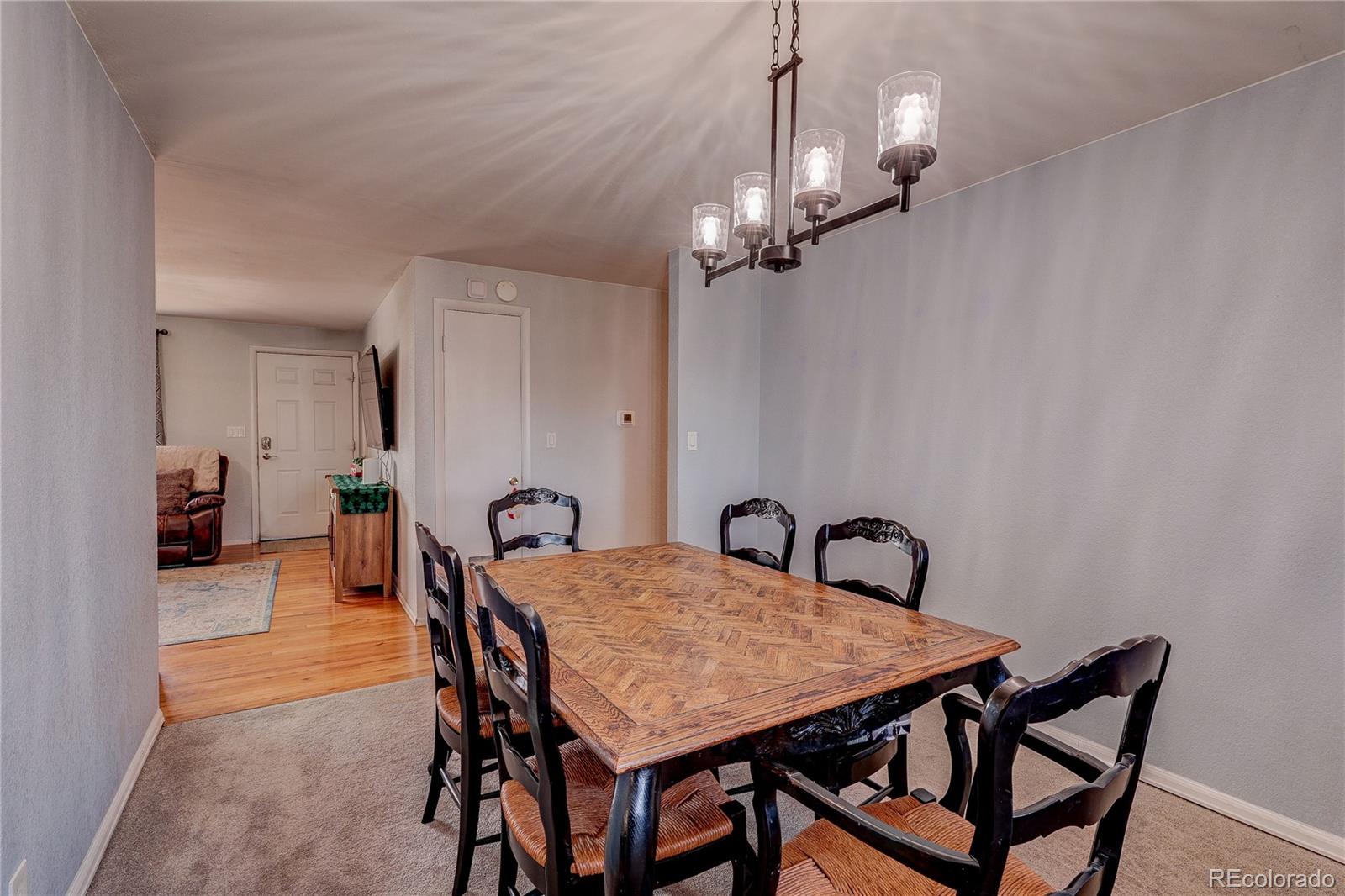 7950 Quebec Street Commerce City, CO 80022 - Photo 14 of 31 a view of a dining room and a chandelier