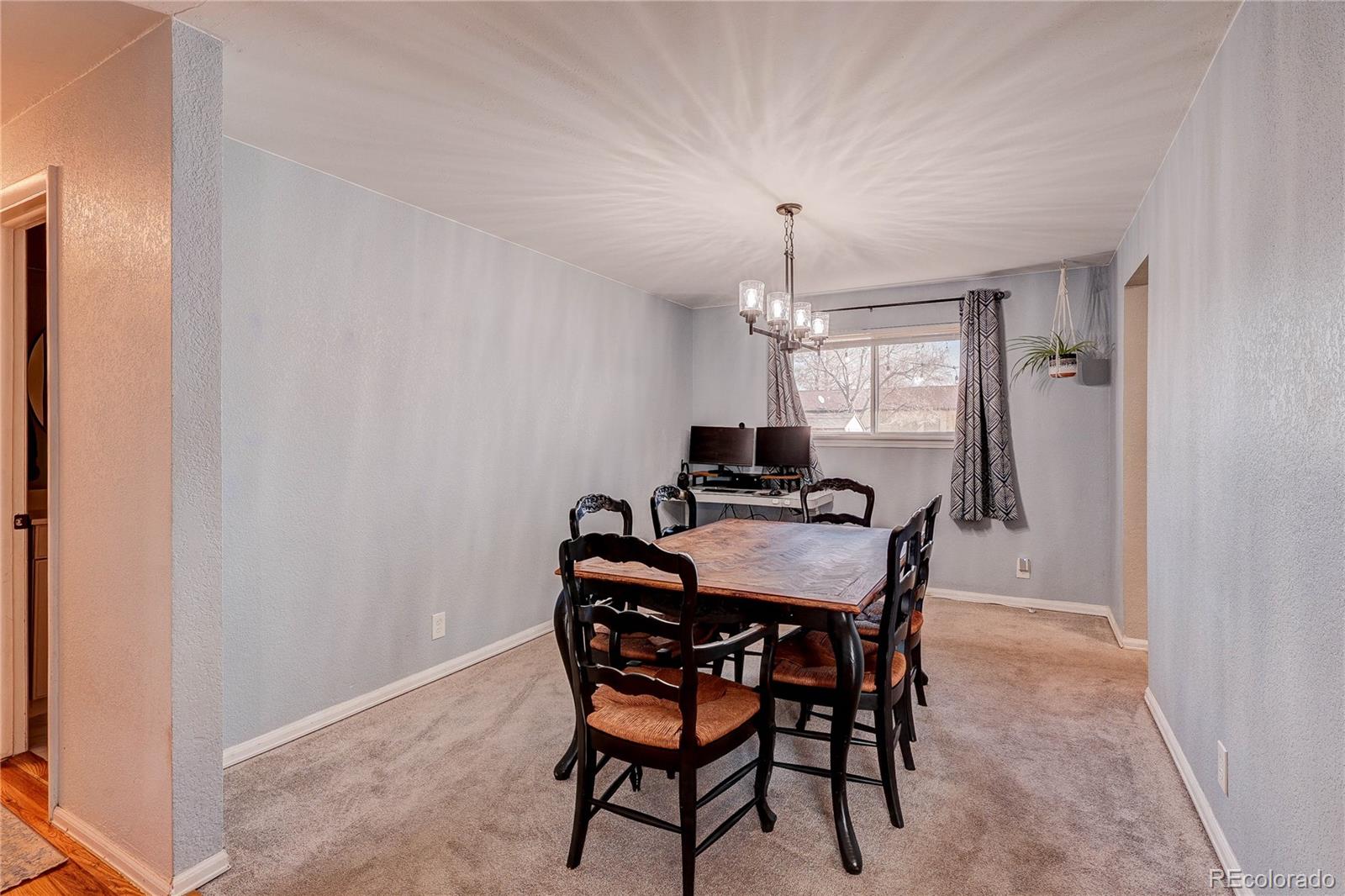 7950 Quebec Street Commerce City, CO 80022 - Photo 15 of 31 a view of a dining room with furniture and window