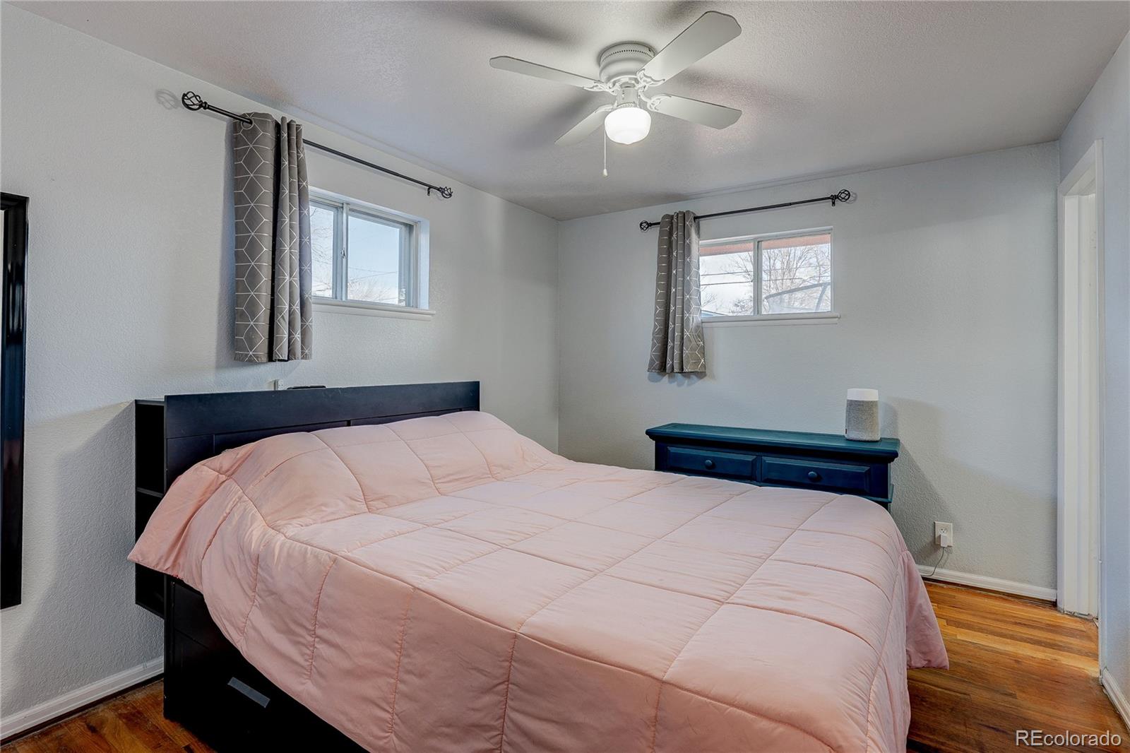 7950 Quebec Street Commerce City, CO 80022 - Photo 21 of 31 a bedroom with a large bed and a window