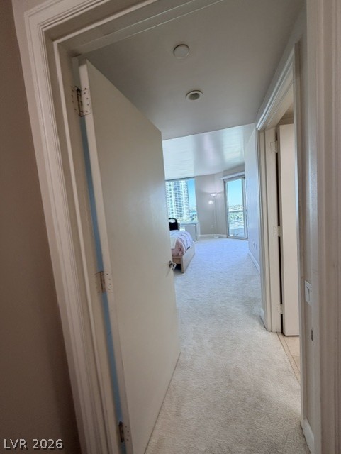 2777 Paradise Road, Unit 807 Las Vegas, NV 89109 - Photo 6 of 61 A well-lit corridor leads to a sun-filled living space with captivating views.