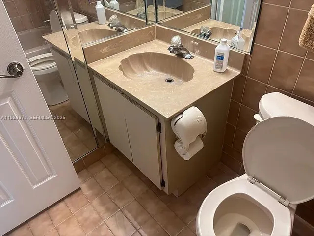 a bathroom with a sink and toilet
