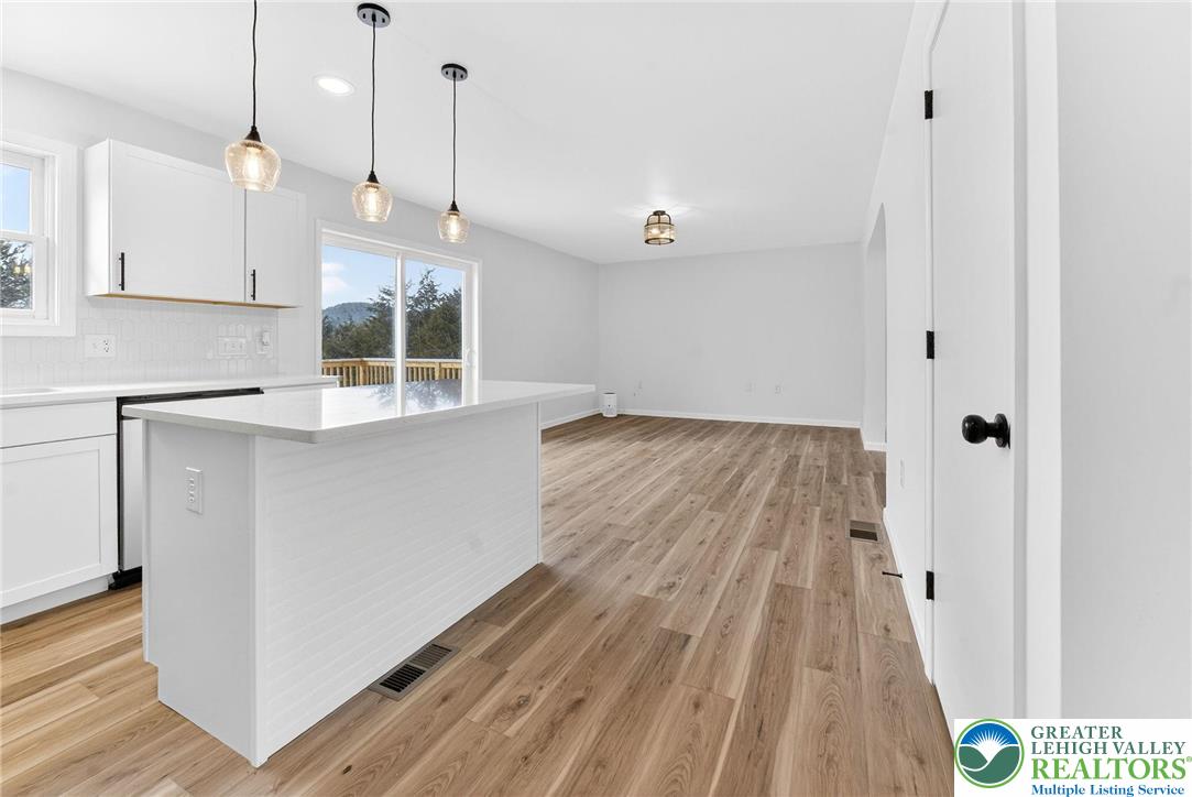 5693 Neola Road Stroudsburg, PA 18360 - Photo 12 of 30 a view of an empty room with wooden floor and a window