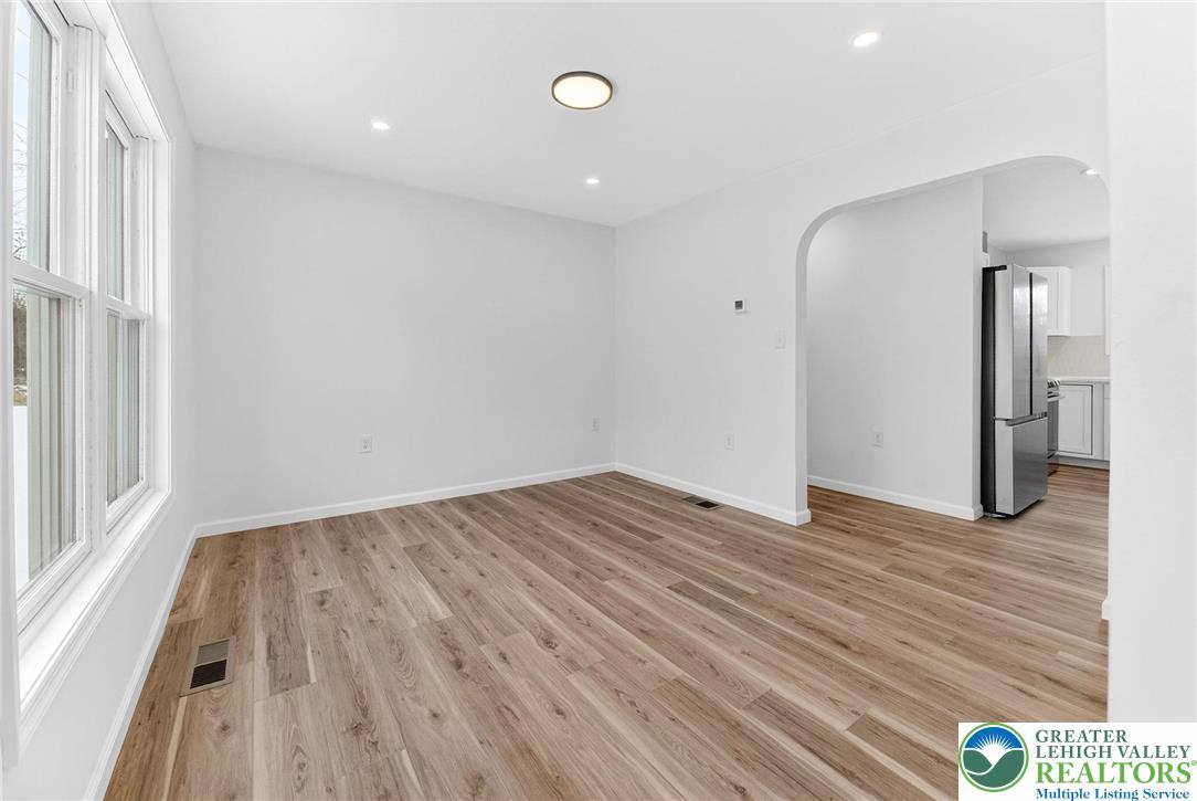 5693 Neola Road Stroudsburg, PA 18360 - Photo 14 of 30 a view of empty room with wooden floor and fan