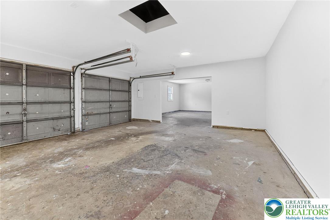 5693 Neola Road Stroudsburg, PA 18360 - Photo 26 of 30 an empty room with a empty space and windows