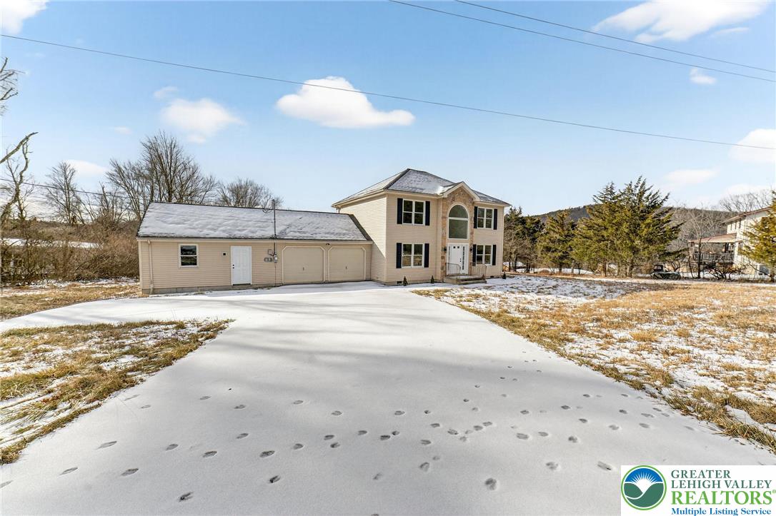 5693 Neola Road Stroudsburg, PA 18360 - Photo 30 of 30 a front view of a house with a yard