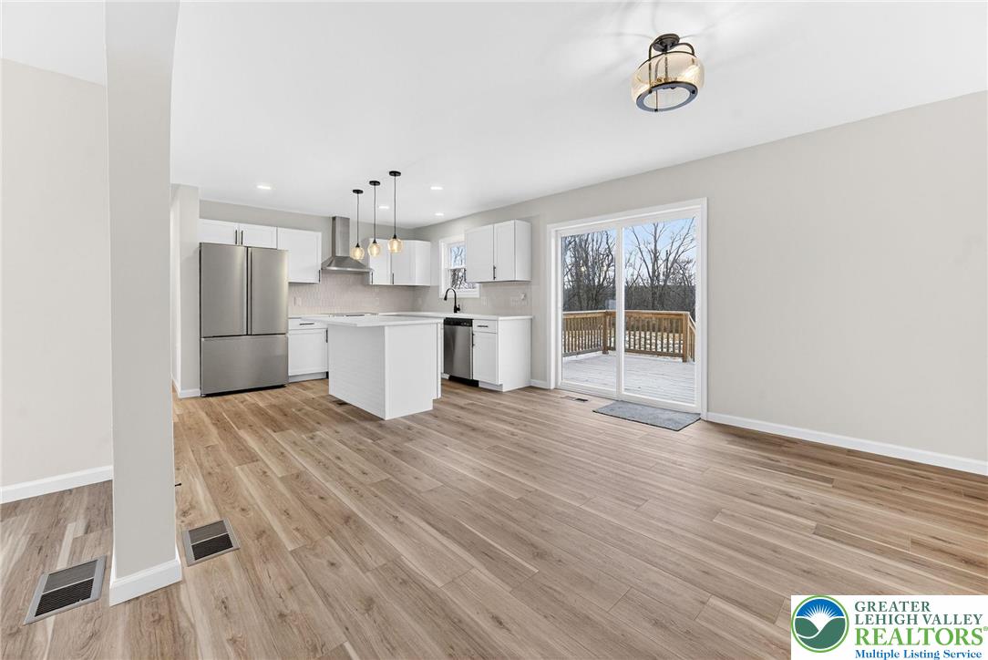 5693 Neola Road Stroudsburg, PA 18360 - Photo 5 of 30 a kitchen with a wooden floor and window