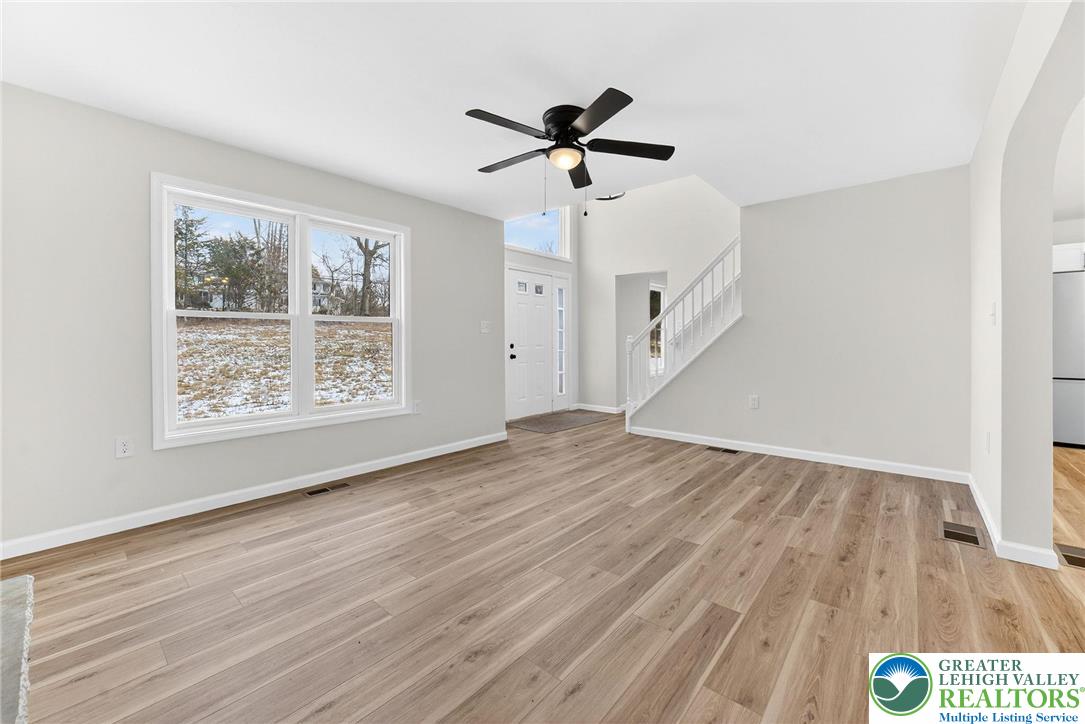 5693 Neola Road Stroudsburg, PA 18360 - Photo 6 of 30 wooden floor in an empty room with a window