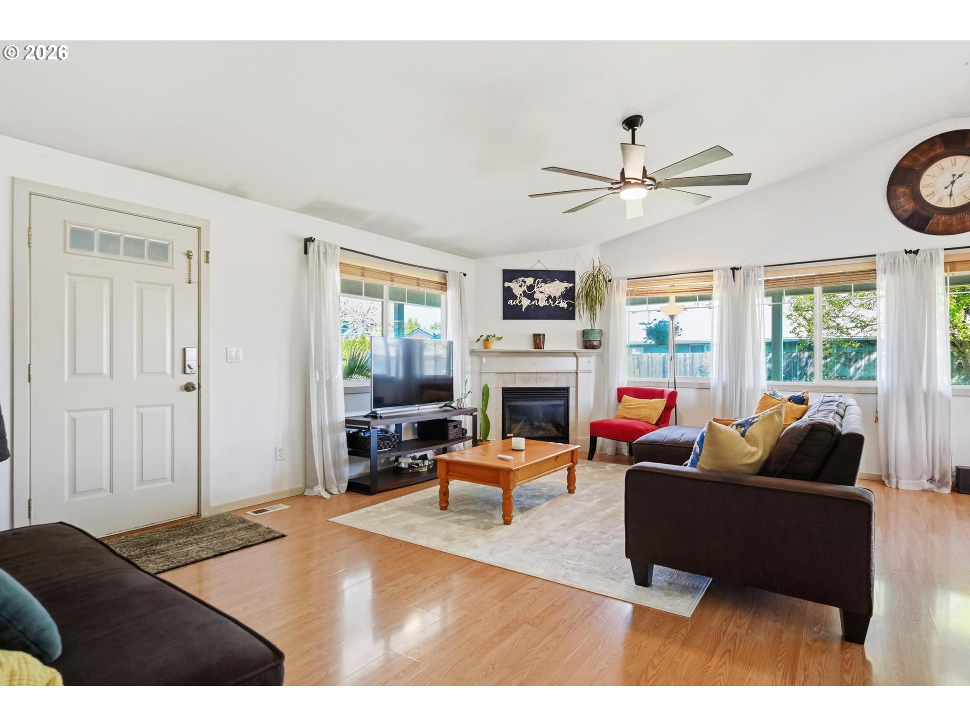 624 North Pershing Street Mount Angel, OR 97362 - Photo 14 of 47 a living room with furniture a fireplace and a window