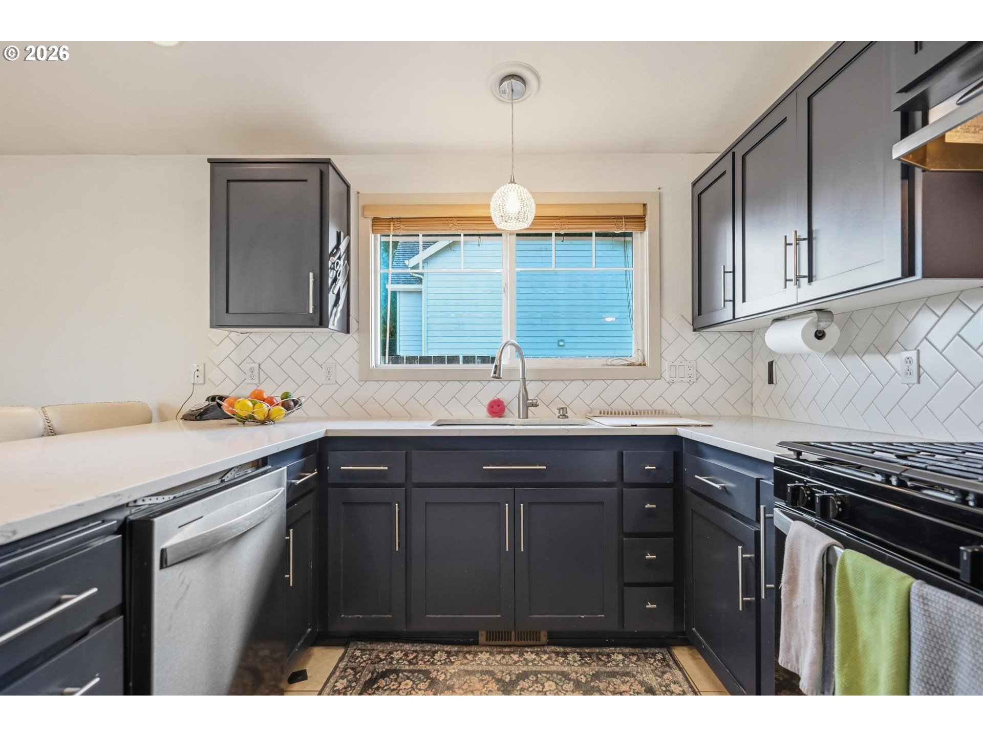 624 North Pershing Street Mount Angel, OR 97362 - Photo 20 of 47 a kitchen with a sink and cabinets