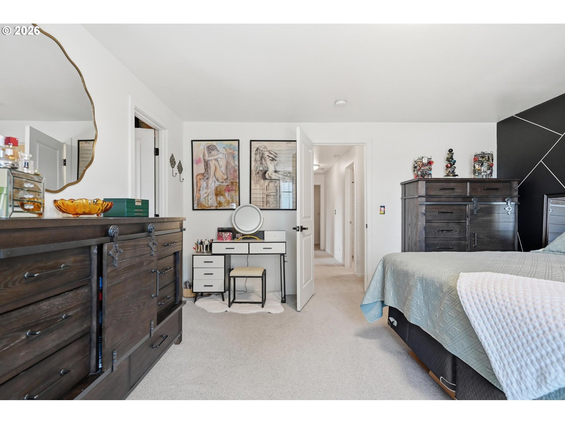 624 North Pershing Street Mount Angel, OR 97362 - Photo 27 of 47 a spacious bedroom with a bed and wooden floor