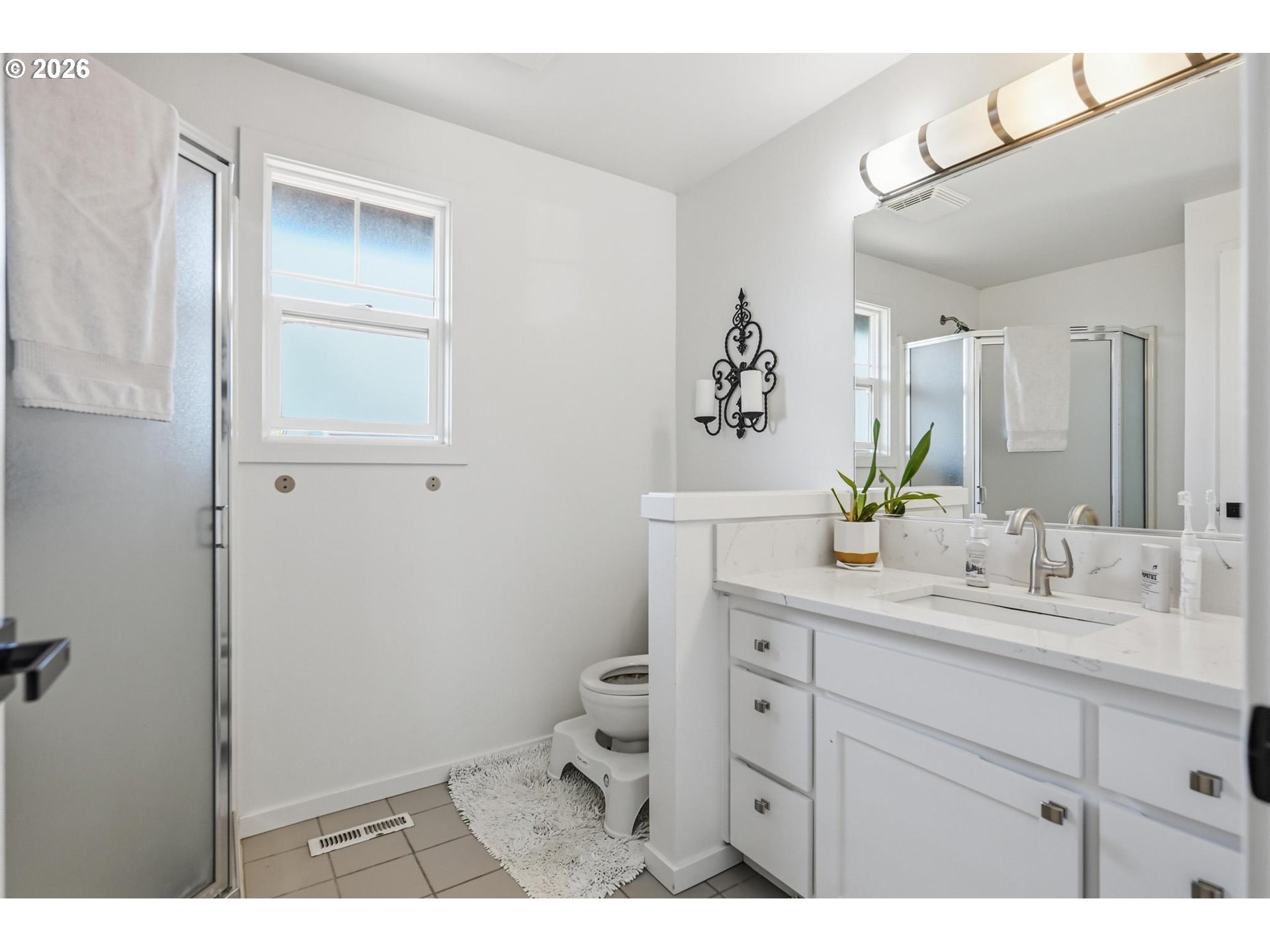 624 North Pershing Street Mount Angel, OR 97362 - Photo 28 of 47 a bathroom with a sink a toilet and mirror