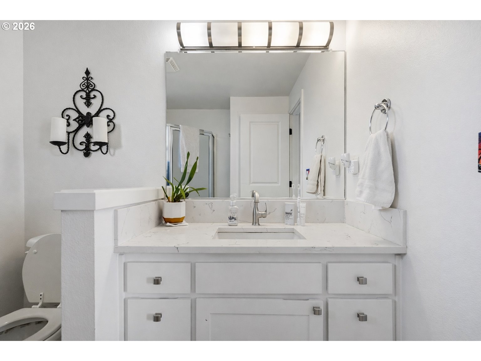 624 North Pershing Street Mount Angel, OR 97362 - Photo 31 of 47 a bathroom with a sink and a mirror
