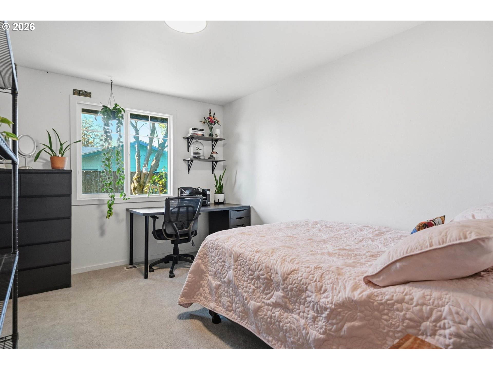 624 North Pershing Street Mount Angel, OR 97362 - Photo 36 of 47 a bedroom with a bed table chair and a window