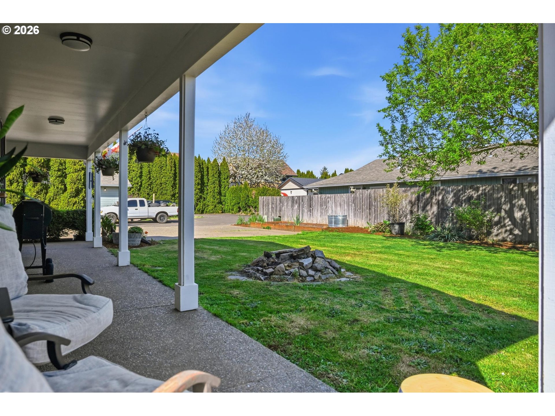 624 North Pershing Street Mount Angel, OR 97362 - Photo 5 of 47 a view of a big room with a big yard and potted plants