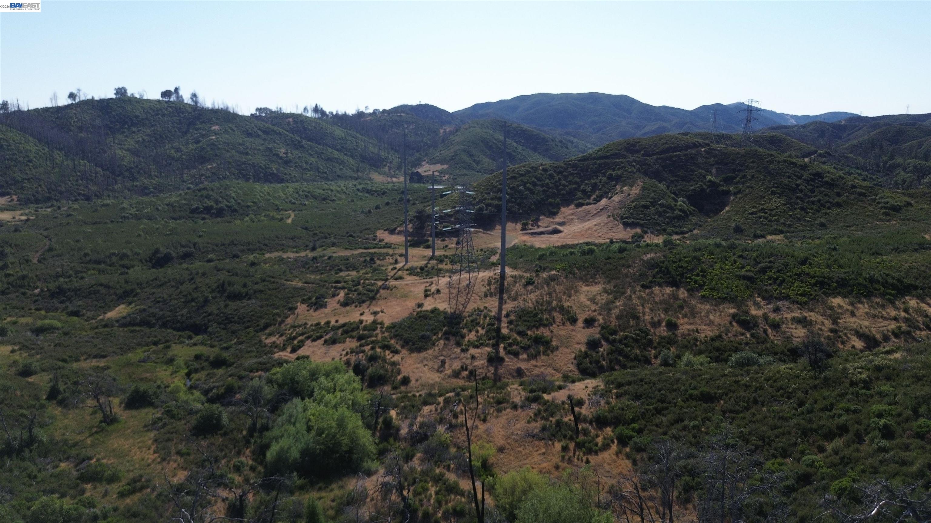11311 Pine Flat Road Healdsburg, CA 95448 - Photo 30 of 45 a view of a lush green hillside and a mountain view
