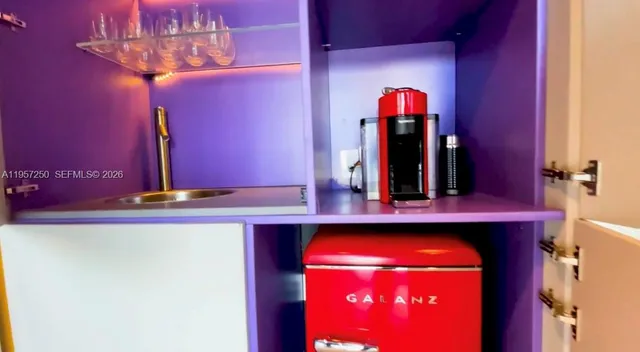 a view of a swimming pool with lawn chairs