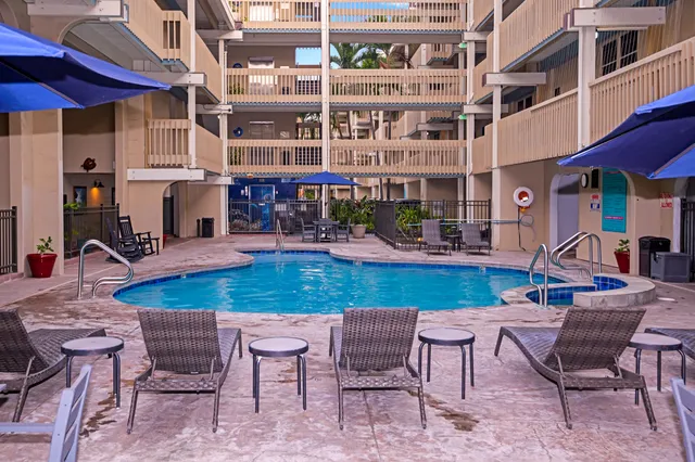 a view of a chairs and table in the patio