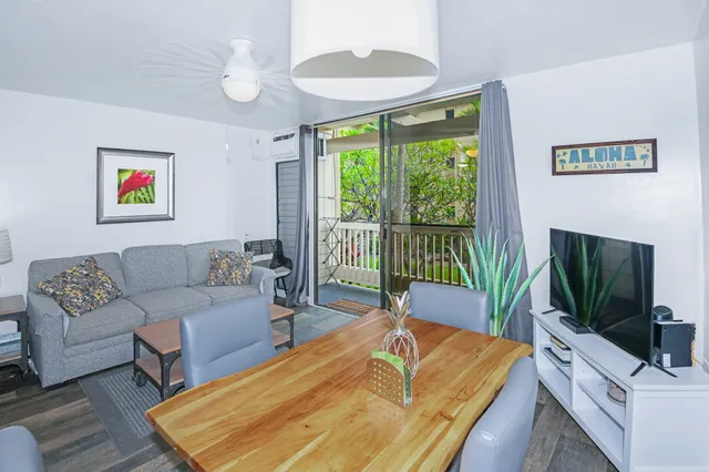 a living room with furniture fireplace and a flat screen tv