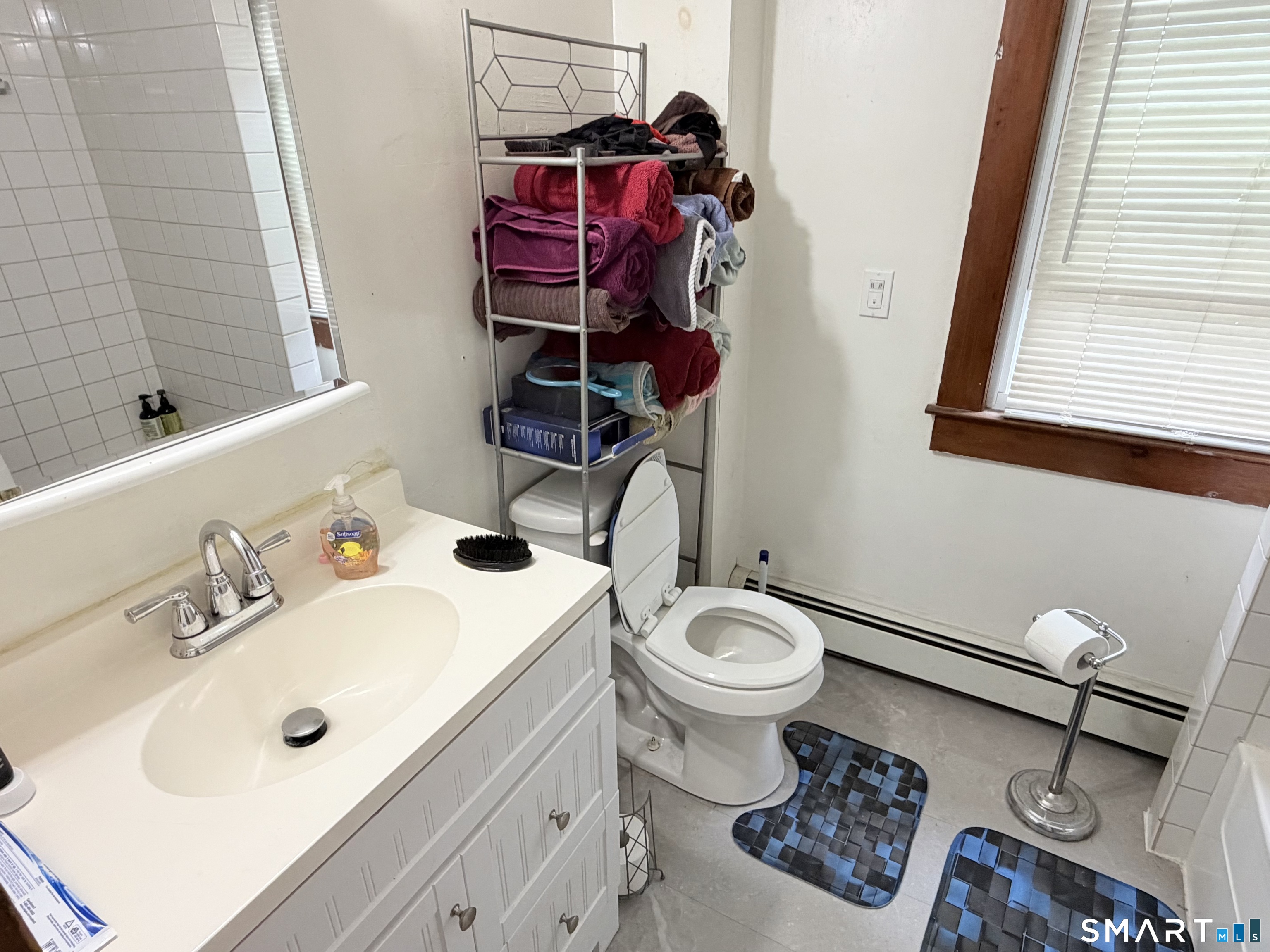 67 Pine Street Meriden, CT 06451 - Photo 21 of 34 a bathroom with a sink mirror and toilet