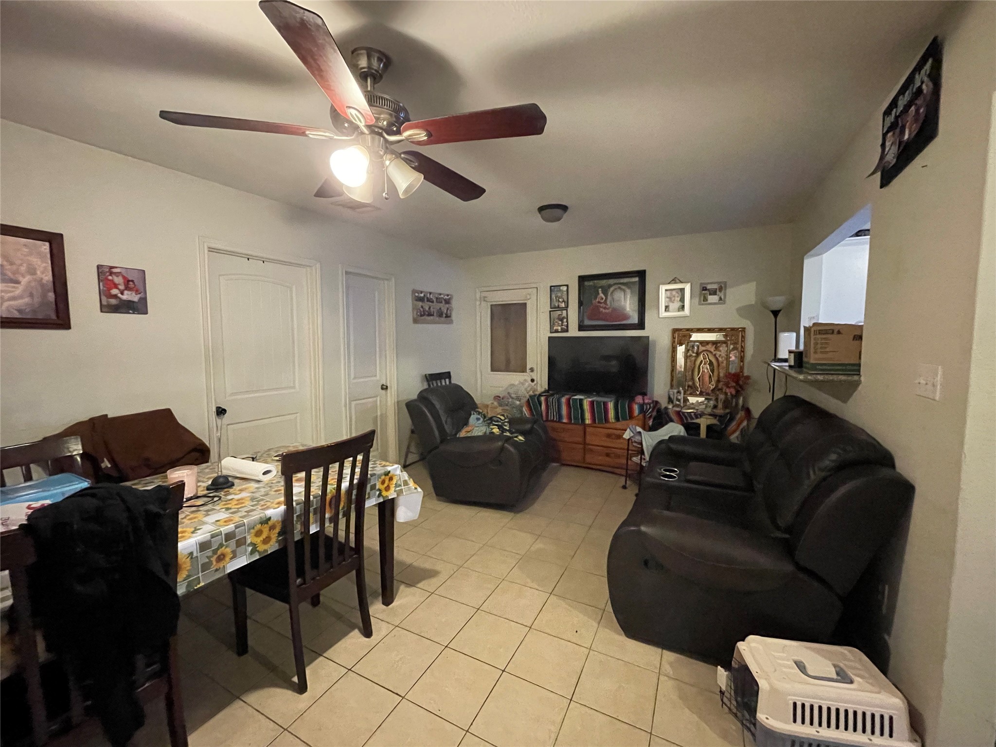 7928 Buchanan Street Houston, TX 77029 - Photo 13 of 25 a living room with furniture and a view of kitchen