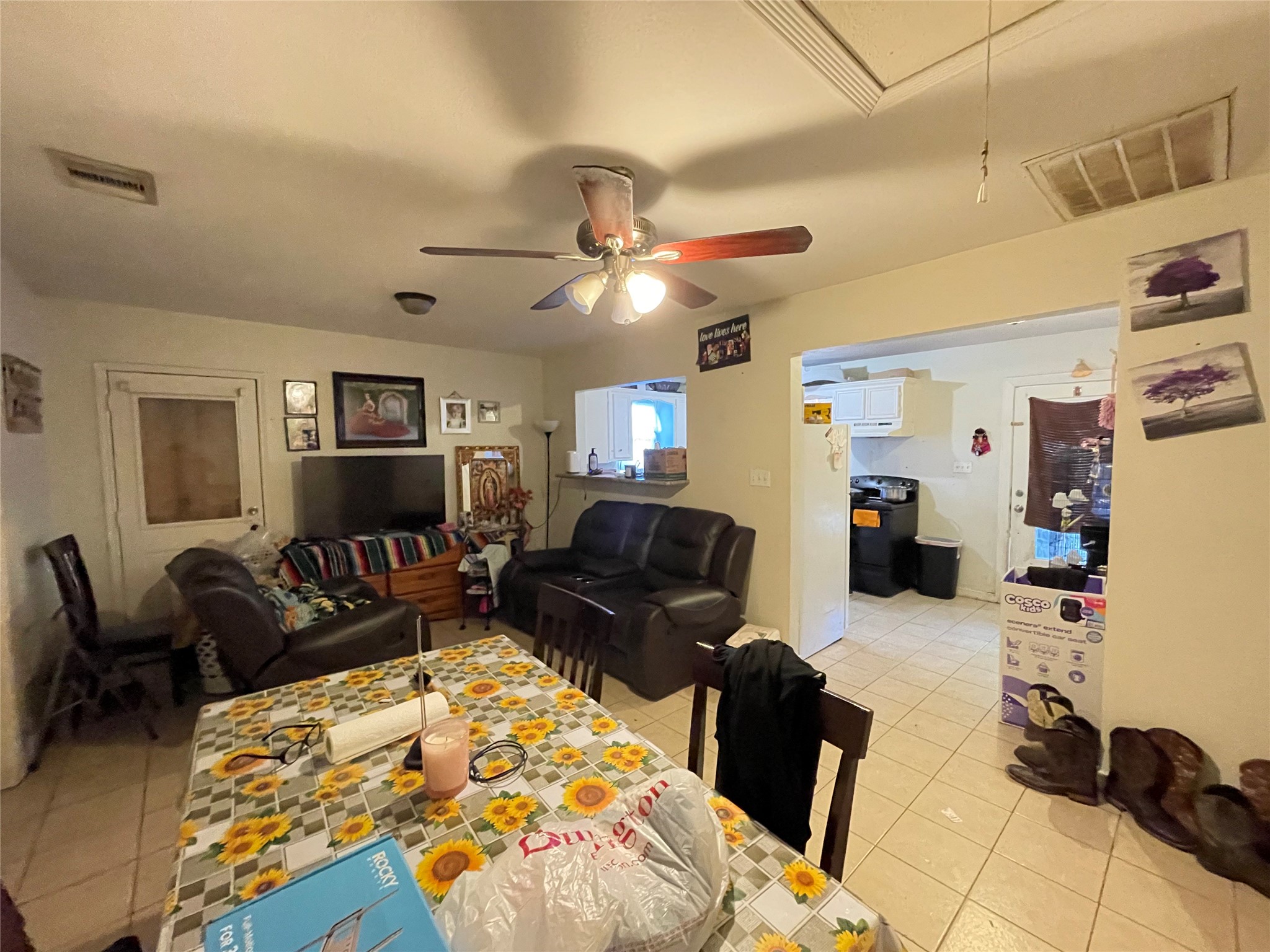 7928 Buchanan Street Houston, TX 77029 - Photo 15 of 25 a living room with furniture ceiling fan and a rug