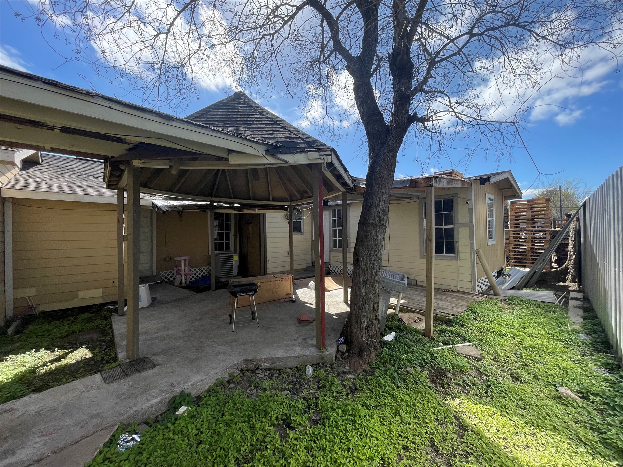 7928 Buchanan Street Houston, TX 77029 - Photo 16 of 25 a view of a chair and table in backyard of the house