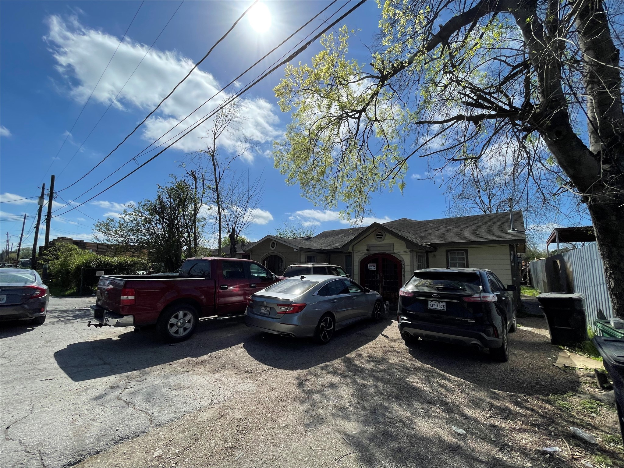 7928 Buchanan Street Houston, TX 77029 - Photo 2 of 25 a front view of a house with cars parked