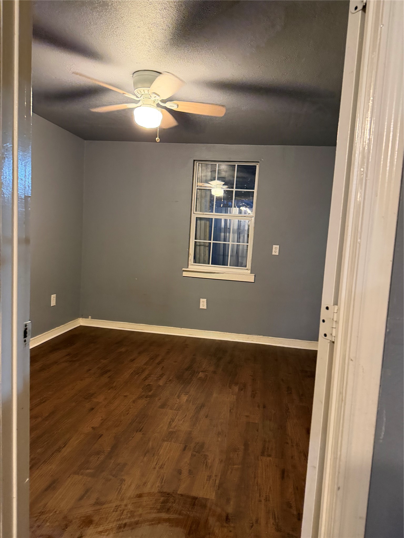 7928 Buchanan Street Houston, TX 77029 - Photo 21 of 25 a view of an empty room with wooden floor and a window