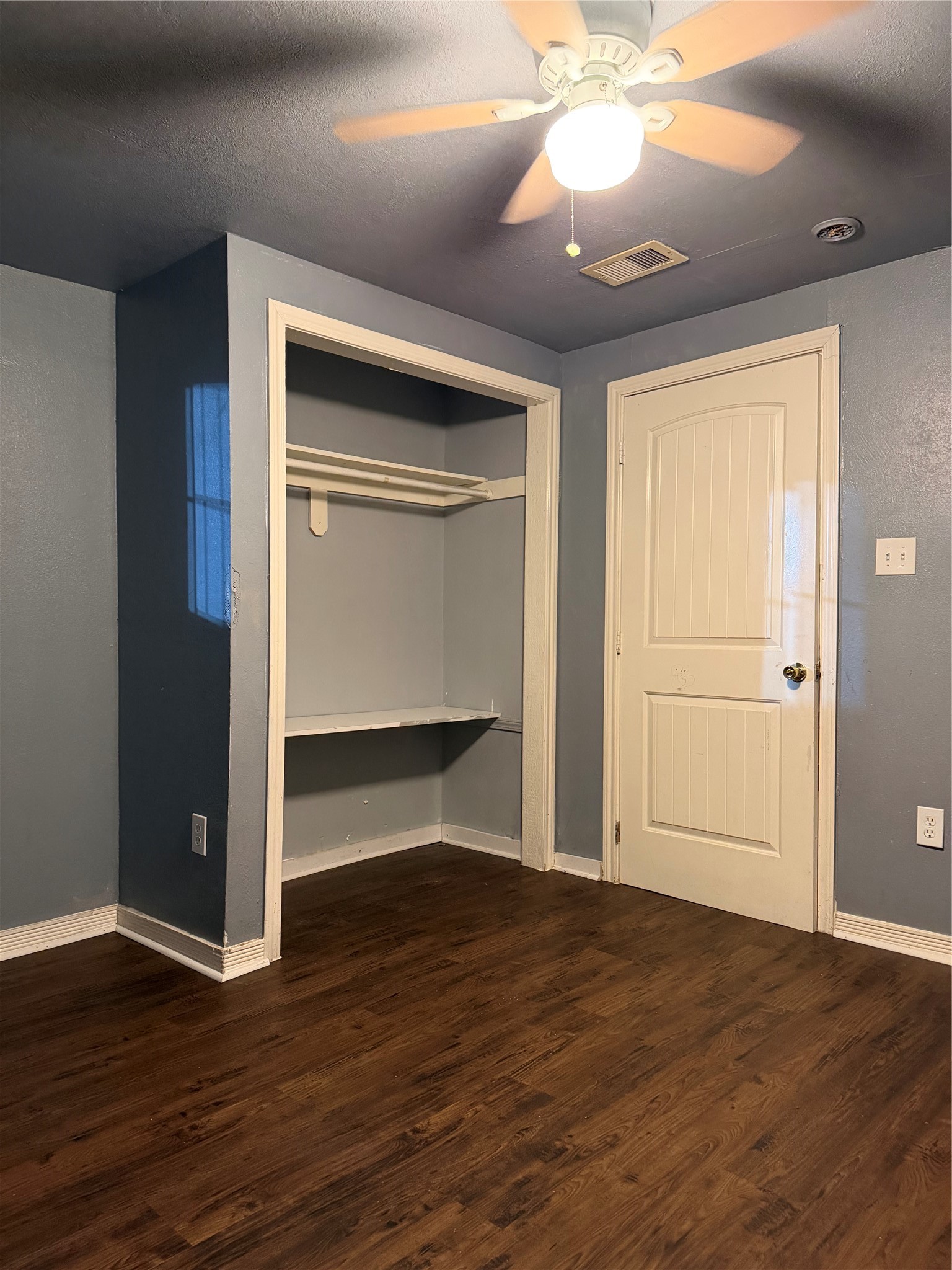 7928 Buchanan Street Houston, TX 77029 - Photo 22 of 25 a view of empty room with wooden floor