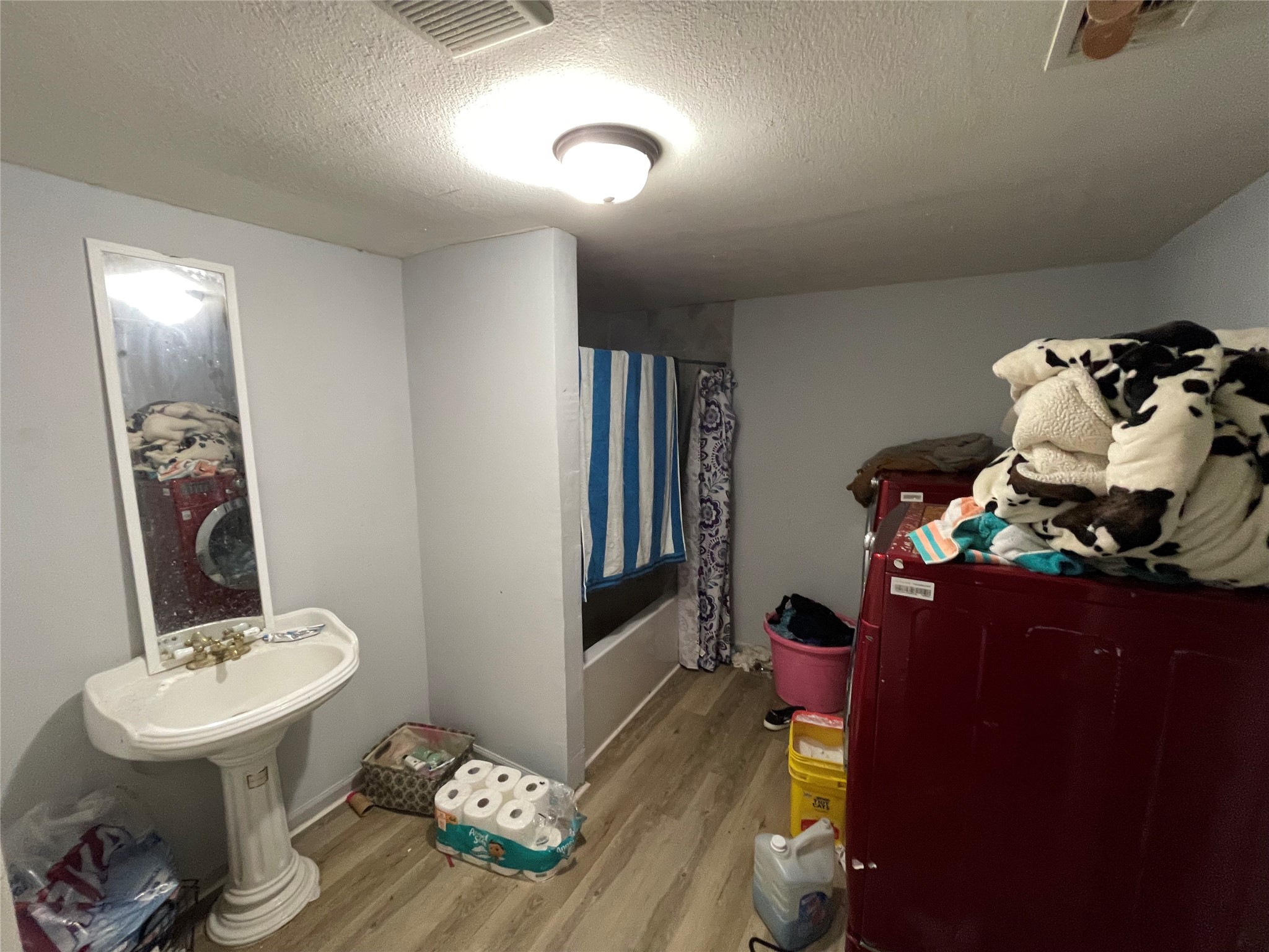 7928 Buchanan Street Houston, TX 77029 - Photo 7 of 25 a bathroom with a sink toilet and mirror