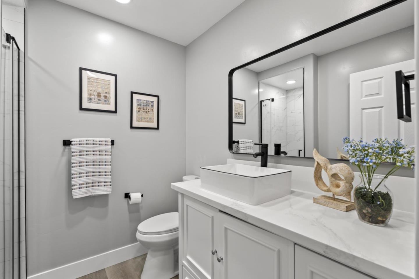 5150 Brookside Lane Concord, CA 94521 - Photo 27 of 54 a bathroom with a toilet a sink and mirror