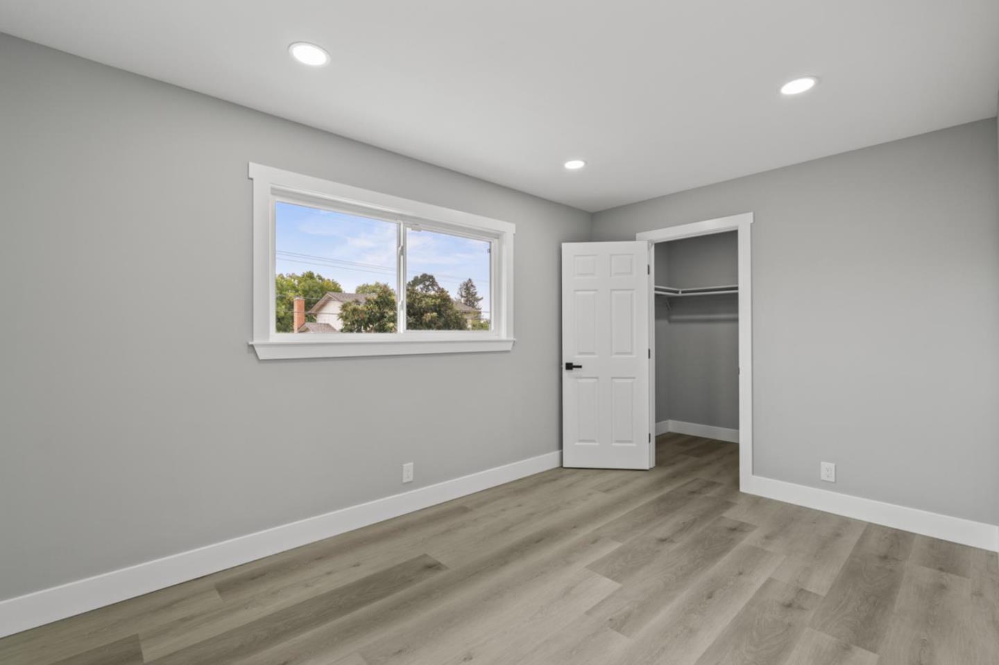 5150 Brookside Lane Concord, CA 94521 - Photo 41 of 54 a view of an empty room with wooden floor and a window
