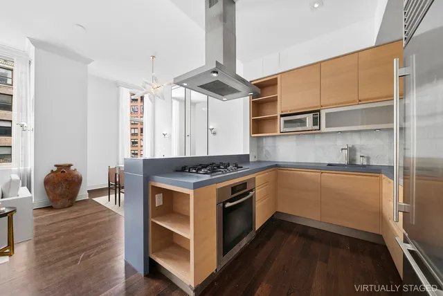 a living room with furniture a rug and a window