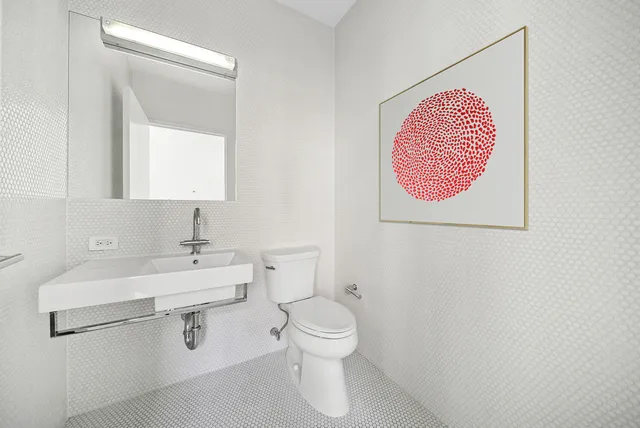 a bedroom with a bed and a table