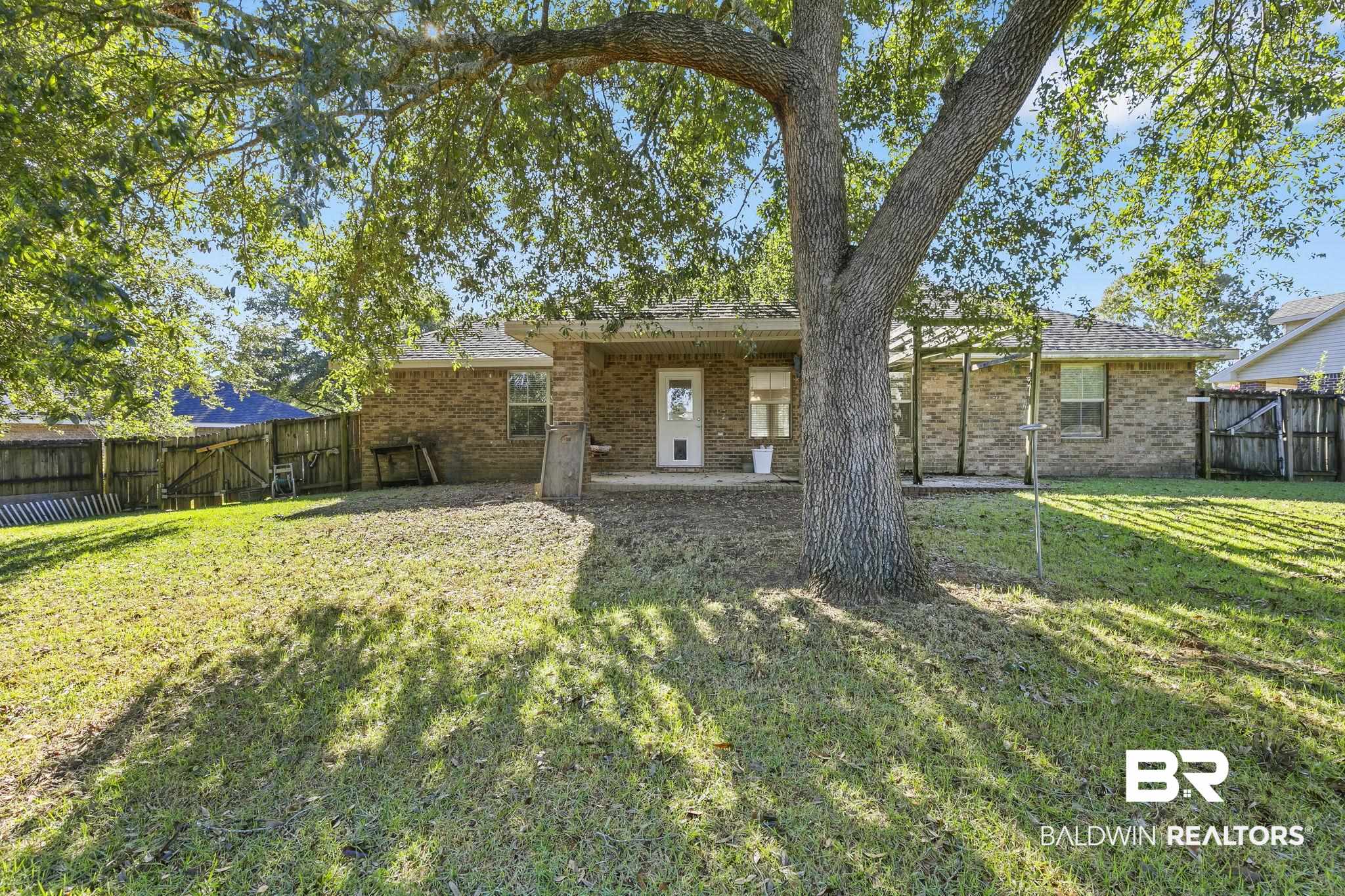 11153 Sturbridge Loop Daphne, AL 36526 - Photo 16 of 79 Back of house with a lawn