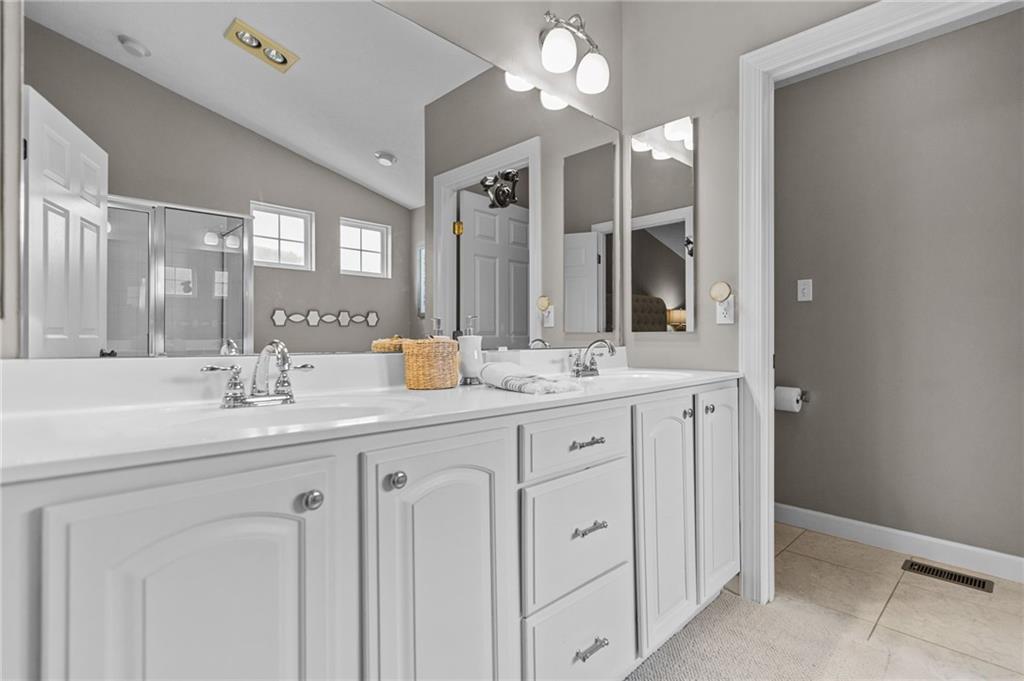 254 Cliffside Drive Mars, PA 16046 - Photo 16 of 25 a bathroom with double sink and a mirror