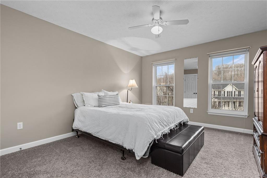 254 Cliffside Drive Mars, PA 16046 - Photo 18 of 25 a bed room with a bed and a couch