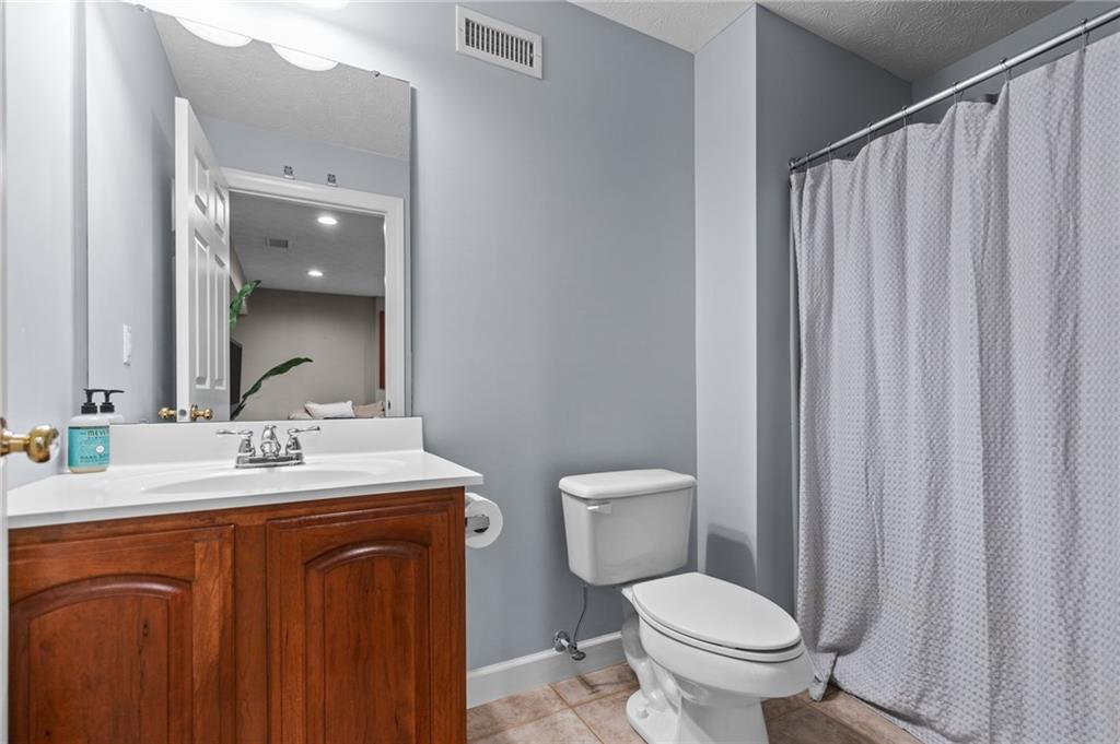 254 Cliffside Drive Mars, PA 16046 - Photo 24 of 25 a bathroom with a toilet a sink and a mirror