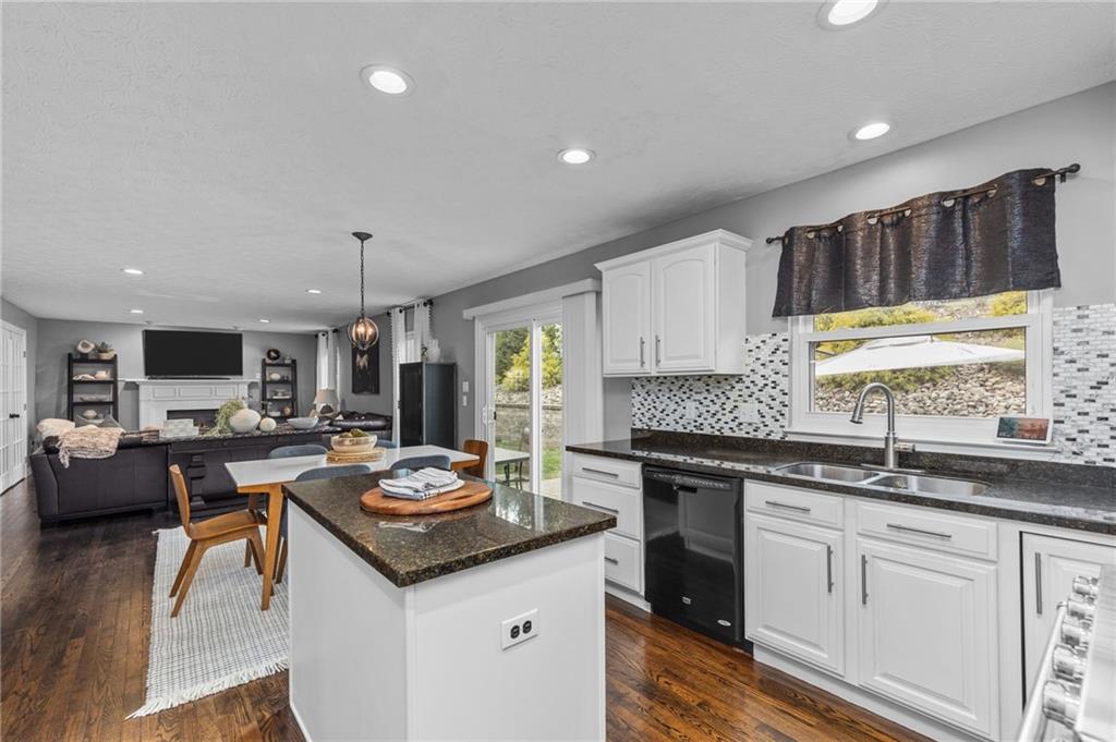 254 Cliffside Drive Mars, PA 16046 - Photo 8 of 25 a kitchen with granite countertop a sink stove and cabinets