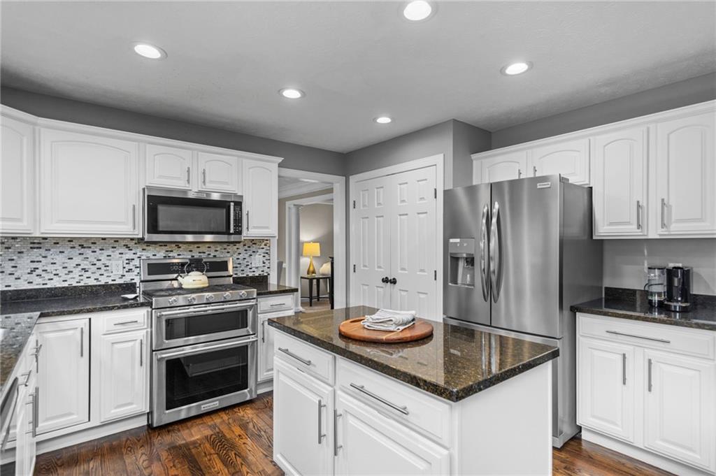 254 Cliffside Drive Mars, PA 16046 - Photo 10 of 25 a kitchen with a sink stove and refrigerator
