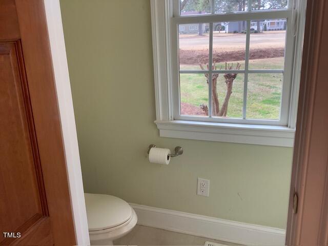2125 Keith Hills Road Lillington, NC 27546 - Photo 38 of 66 a white toilet sitting next to a window