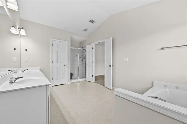 a en suite bathroom with a sink and a mirror